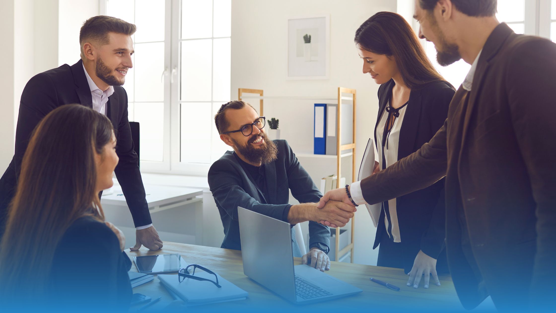 Business professionals shaking hands over a certified contract, symbolizing trust, alignment, and accelerated deal closure through contract terms certification