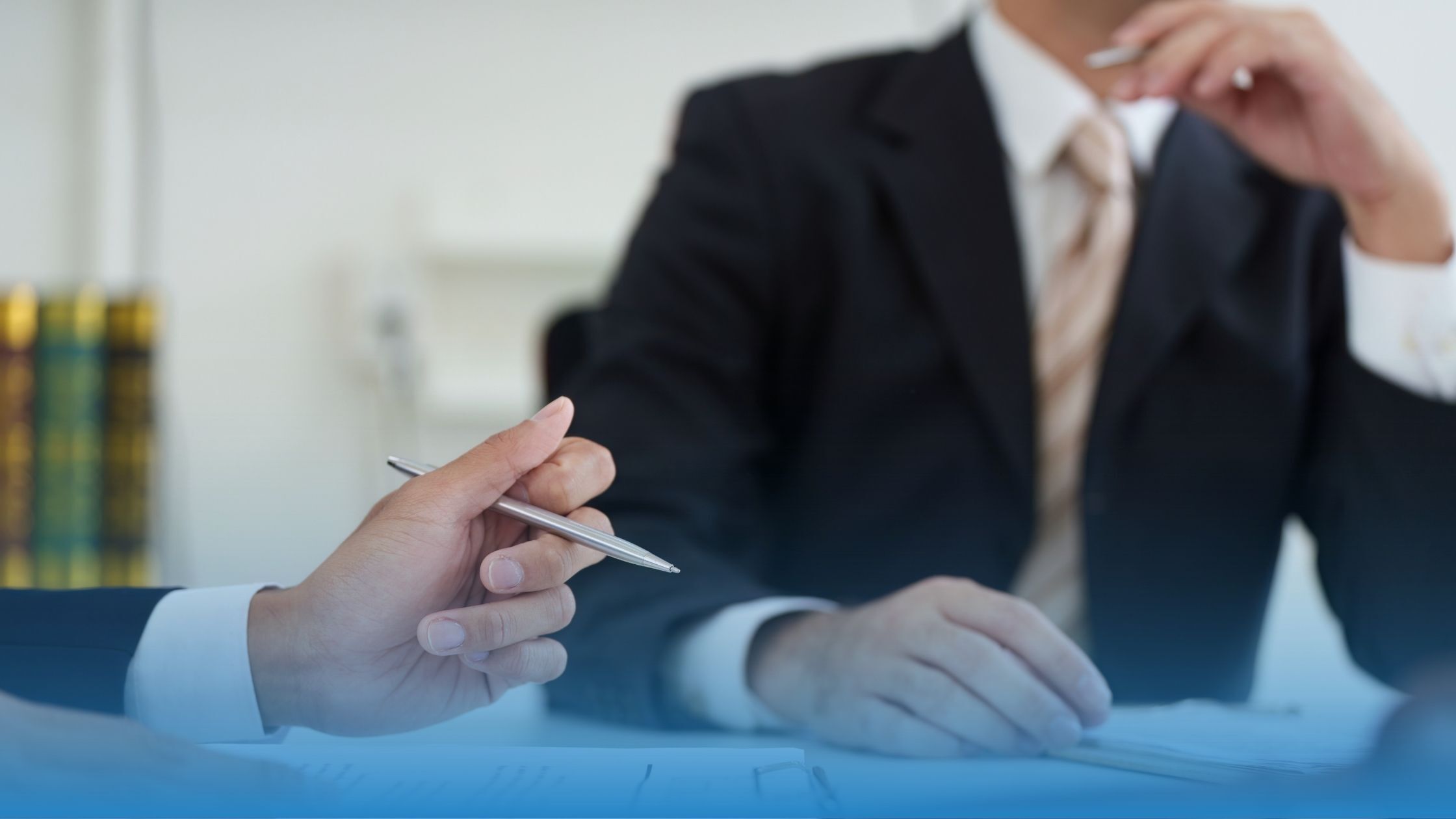 Two legal professionals talking about how to improve contract designs with market data